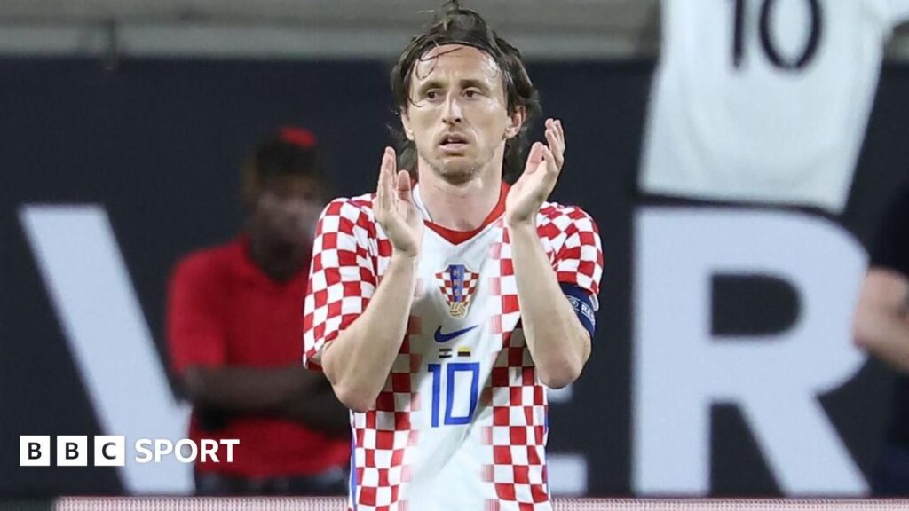 Luka Modric wearing a protective face mask while playing for Croatia