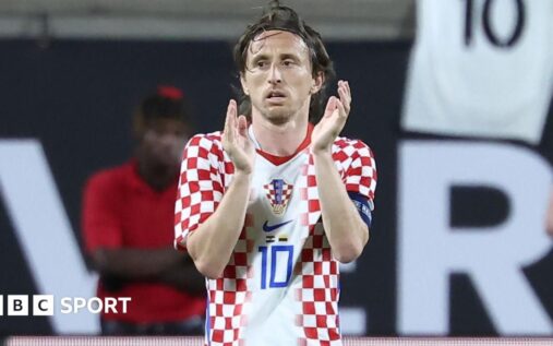 Luka Modric wearing a protective face mask while playing for Croatia