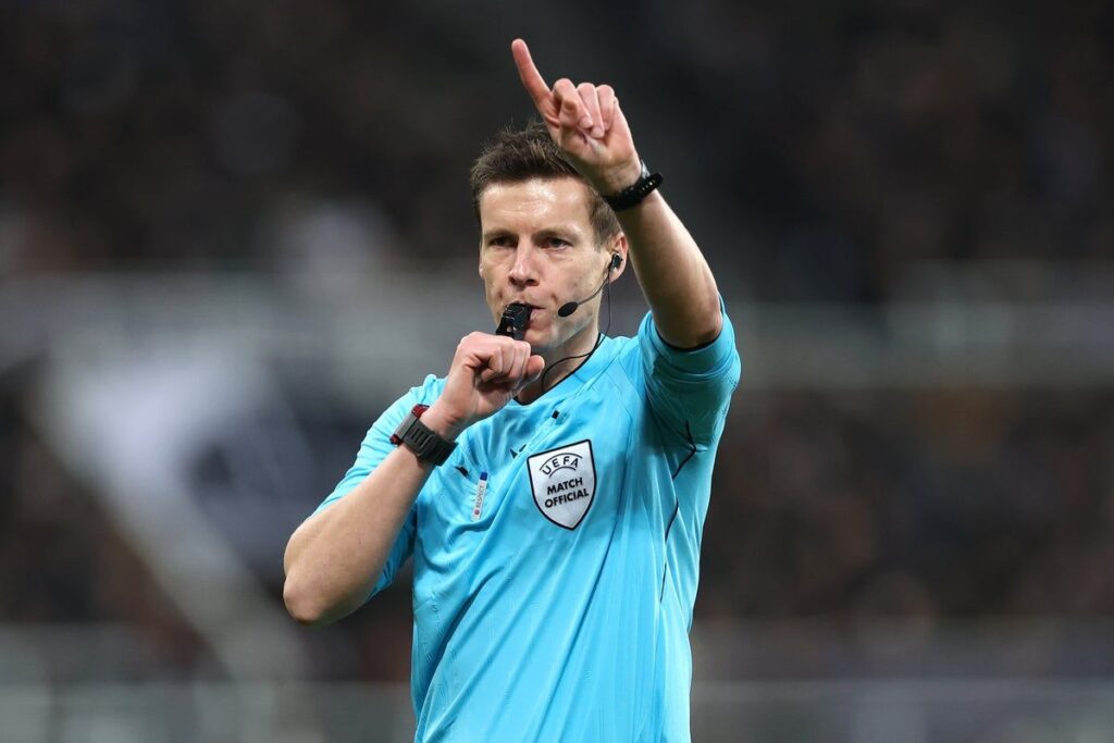 German referee Daniel Siebert pointing during a Champions League football match