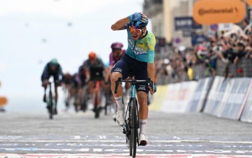 Davide Ballerini celebrating as he crosses the finish line to win stage six of the Giro d'Italia