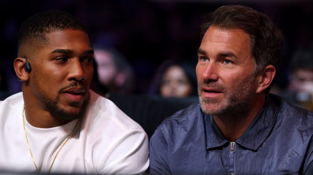 Eddie Hearn and Dana White standing near a boxing ring during a promotional event