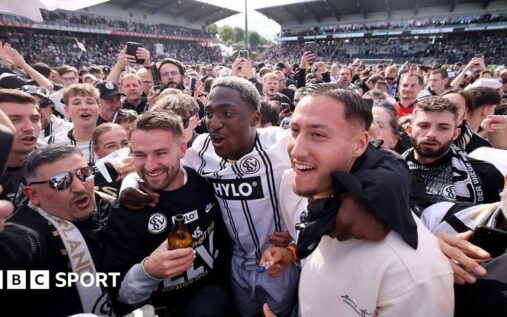 Elversberg supporters spilling onto the pitch to celebrate their historic promotion to the Bundesliga