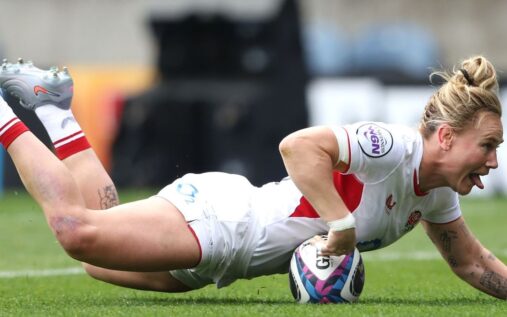 England and France women's rugby players competing in a physical Six Nations match