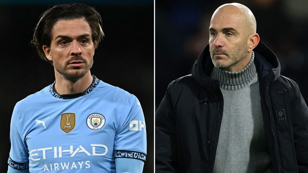 Jack Grealish looking thoughtful while wearing a Manchester City kit