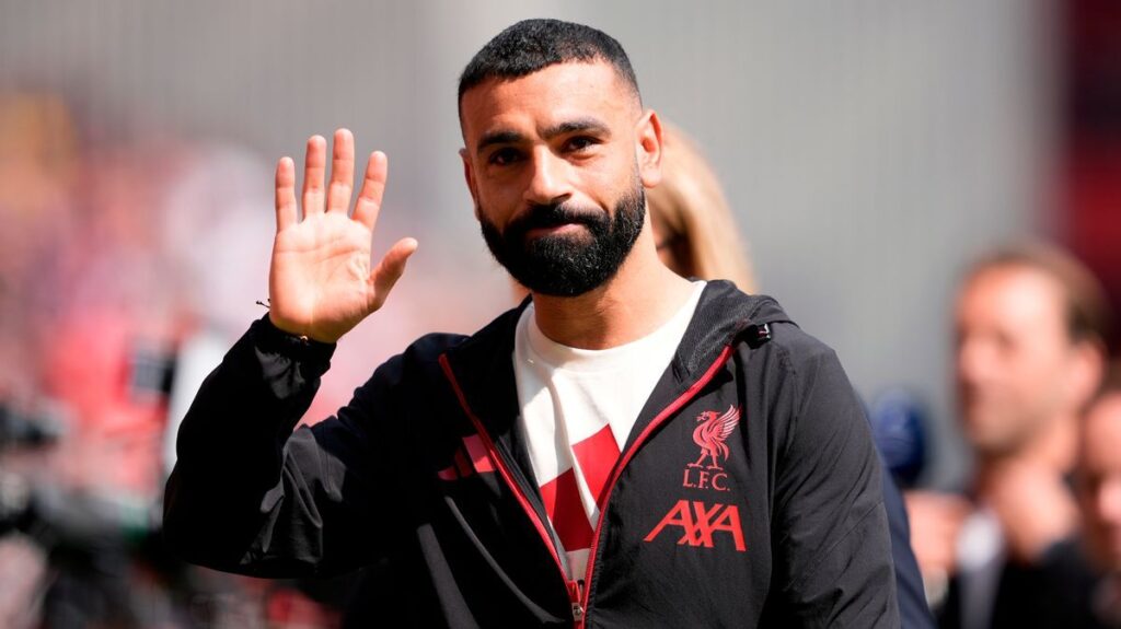 Mohamed Salah looking contemplative in a Liverpool kit during a Premier League match