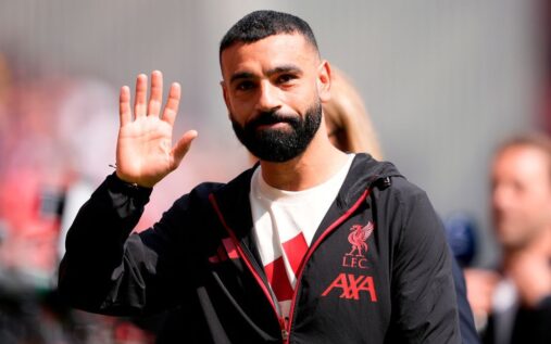 Mohamed Salah looking contemplative in a Liverpool kit during a Premier League match