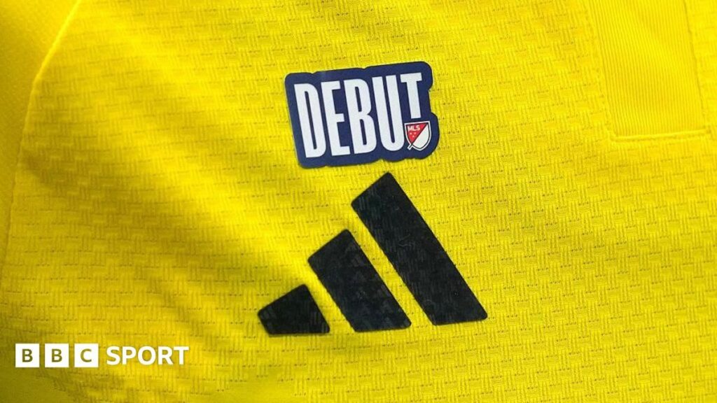 A national team football shirt featuring a newly introduced World Cup debut patch on the upper-right chest