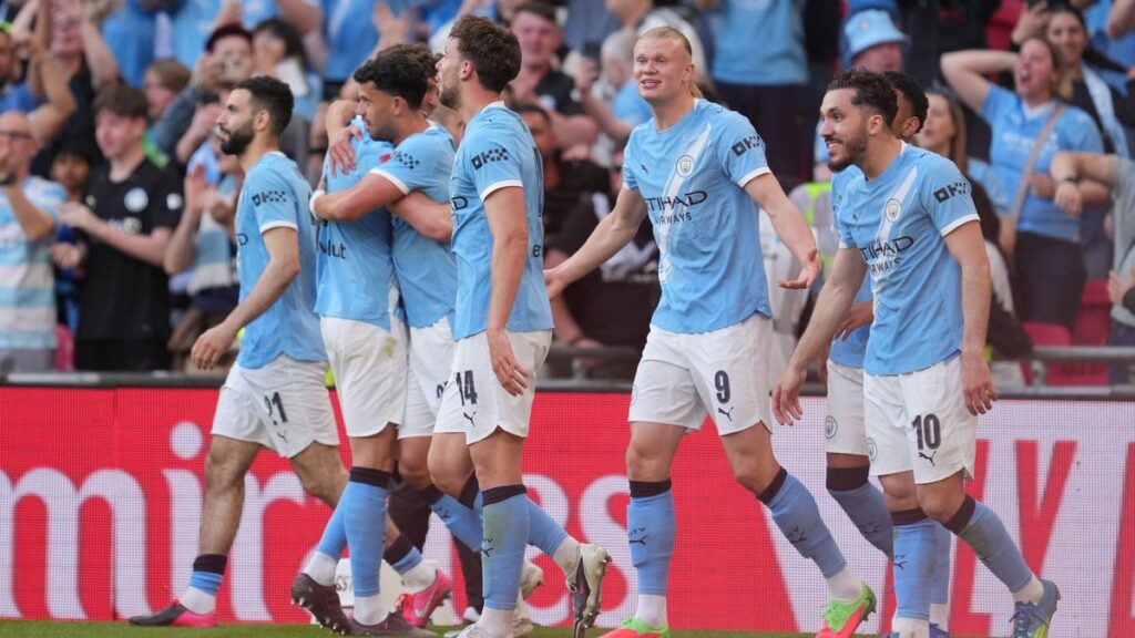Manchester City manager Pep Guardiola looking serious on the touchline during a Premier League match