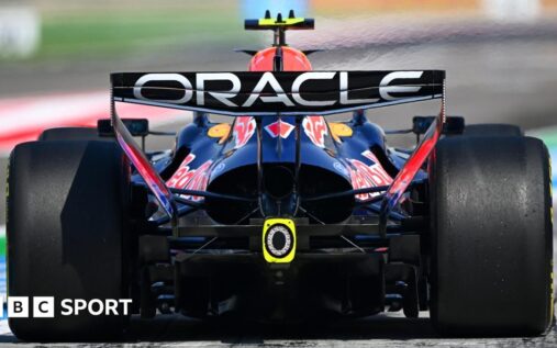Formula 1 cars racing on track with a focus on the rear engine and exhaust area