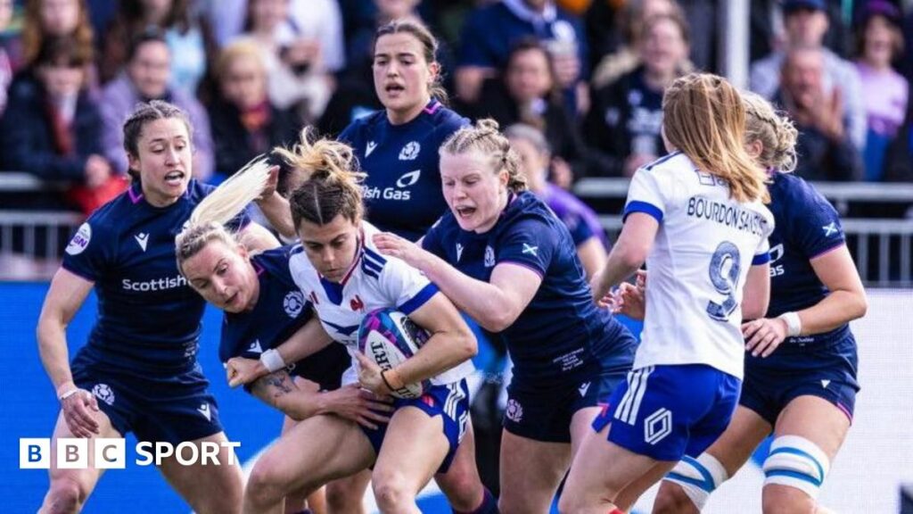 France rugby players celebrating a try against Scotland during their Women's Six Nations match