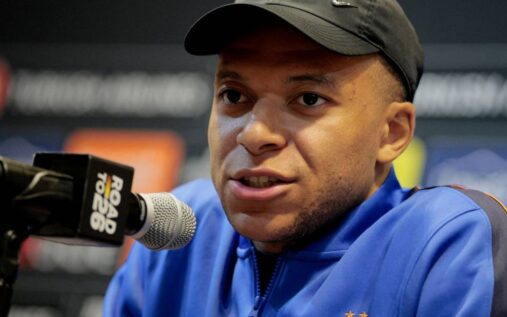 Kylian Mbappe wearing the France national team captain's armband looking serious