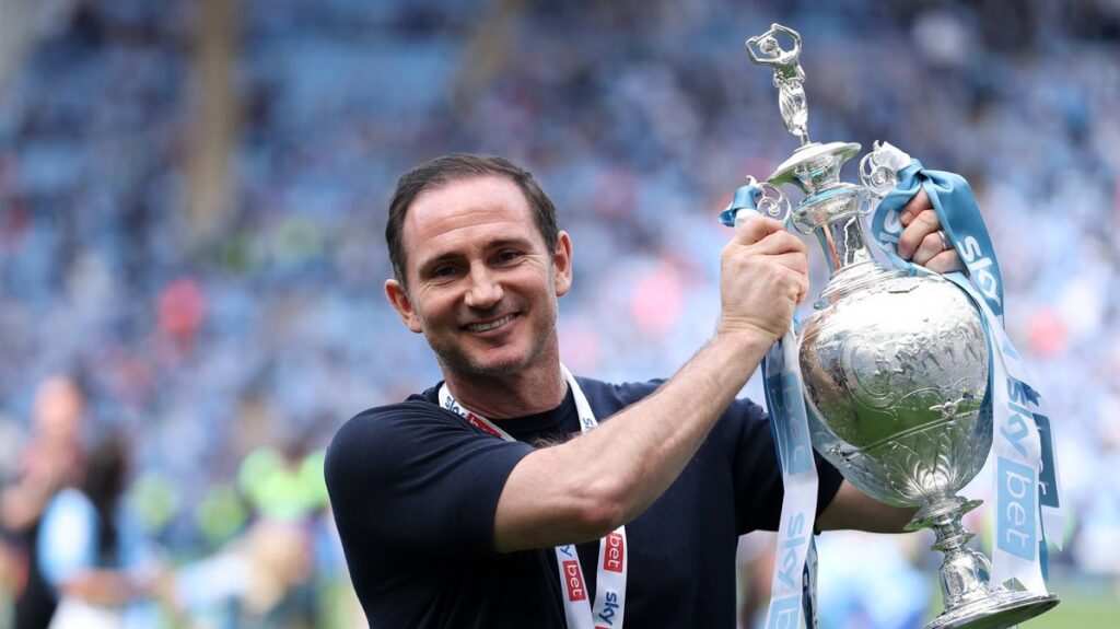 Coventry City manager Frank Lampard applauds supporters from the touchline during a football match