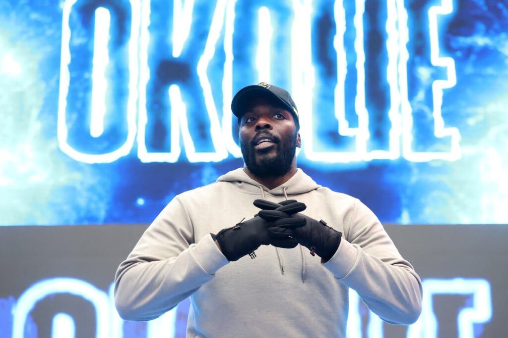 Boxer Lawrence Okolie and promoter Frank Warren at a press conference