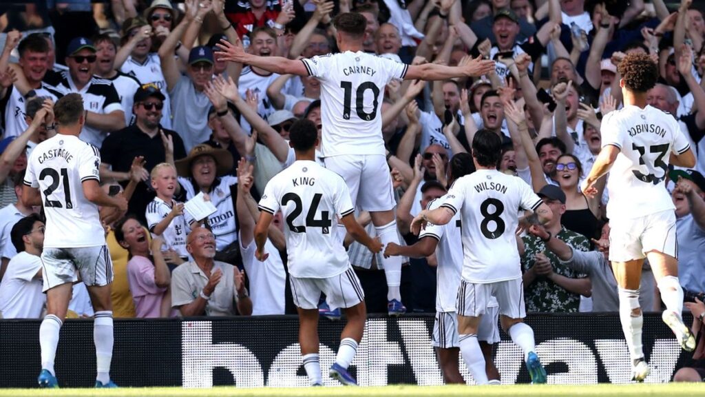 Tom Cairney of Fulham celebrating his long-range goal against Newcastle United at Craven Cottage