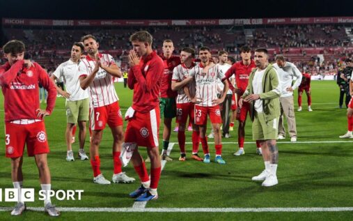 Girona players look dejected on the pitch after their relegation from La Liga is confirmed