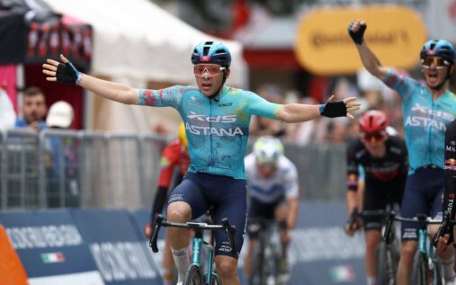 Guillermo Thomas Silva celebrating his stage two victory at the Giro d'Italia while wearing the pink jersey
