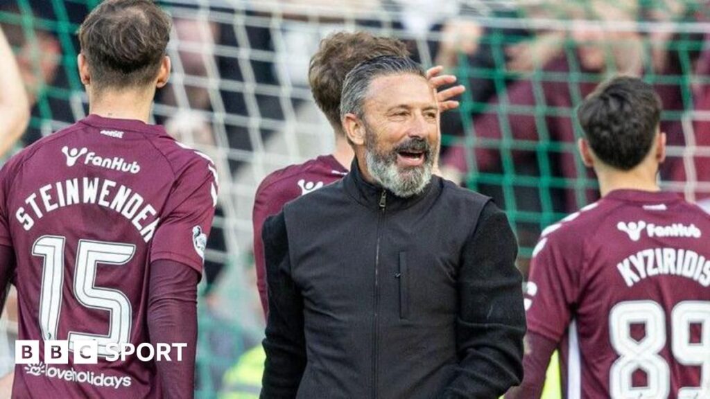 Hearts and Celtic players competing fiercely during a Scottish Premiership match