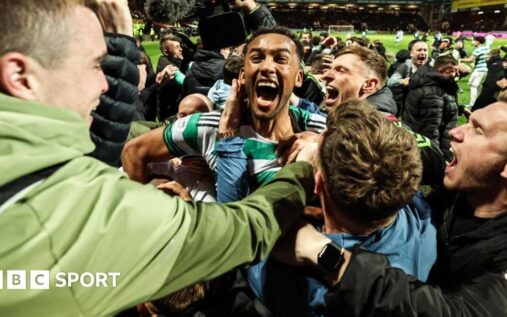 Celtic and Hearts players competing during a tense Scottish Premiership match