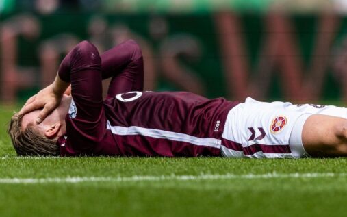 Celtic fans invading the pitch at Parkhead while Hearts players leave the field