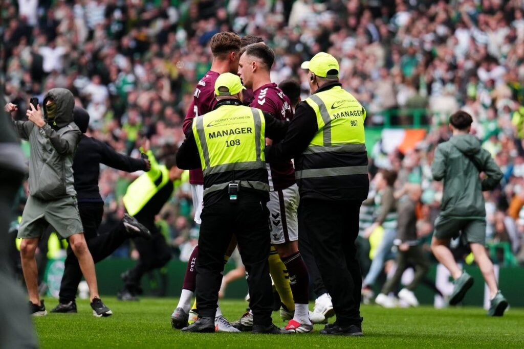 Celtic supporters invading the pitch at Celtic Park during the Scottish Premiership title decider against Hearts