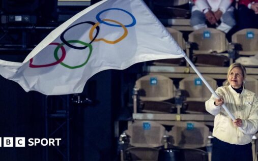 The Olympic rings logo displayed outside an international sporting venue