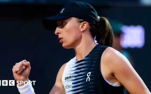 Iga Swiatek hitting a forehand on the clay courts at the Italian Open in Rome