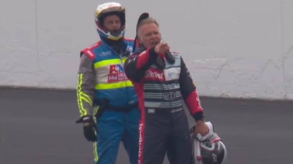 Ed Carpenter angrily gesturing at Takuma Sato's car on the Indianapolis 500 track
