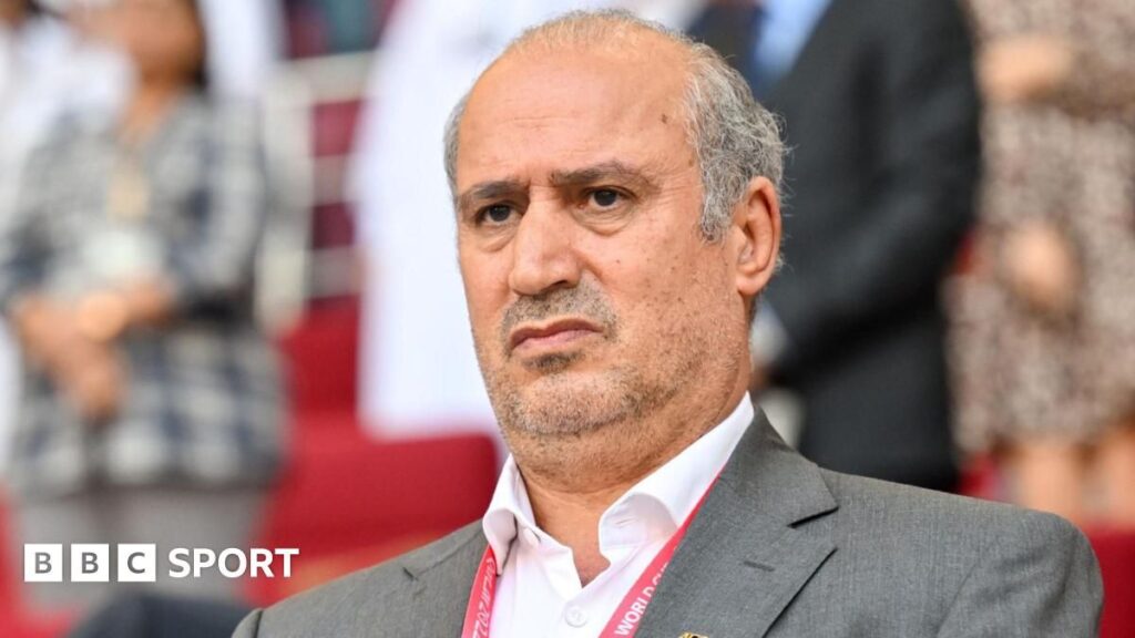 Mehdi Taj speaking at a press conference for the Iranian Football Federation