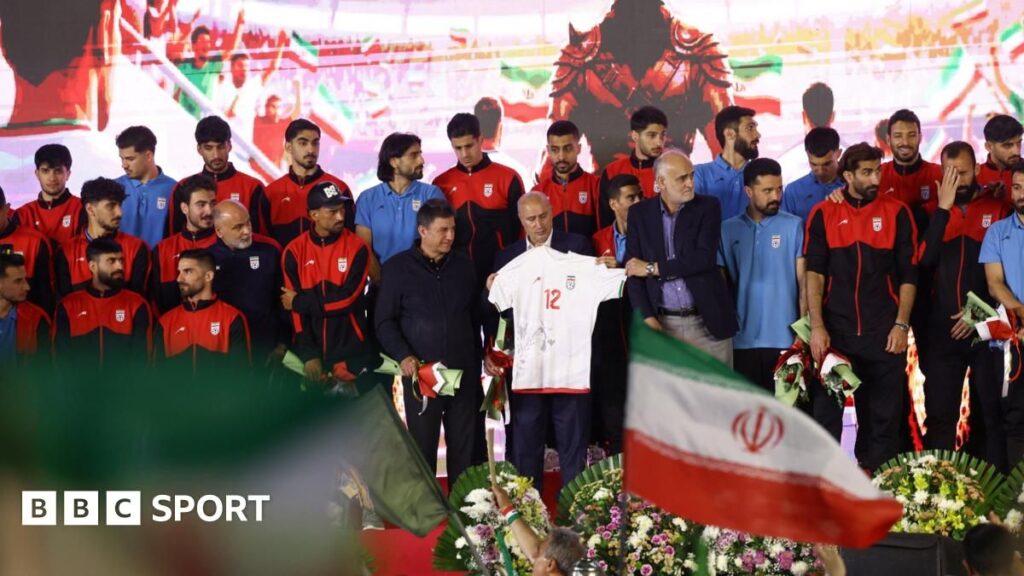 Iranian national football team players standing together on the pitch