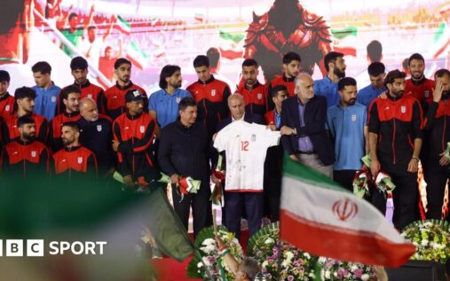 Iranian national football team players standing together on the pitch