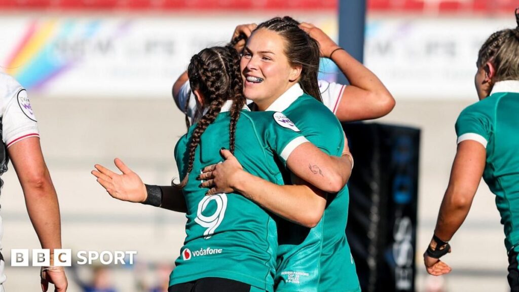 Ireland rugby player breaking through the Wales defence during the Women's Six Nations match