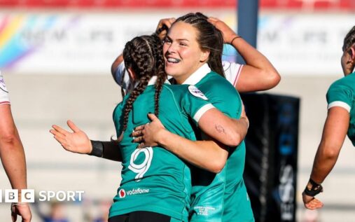 Ireland rugby player breaking through the Wales defence during the Women's Six Nations match