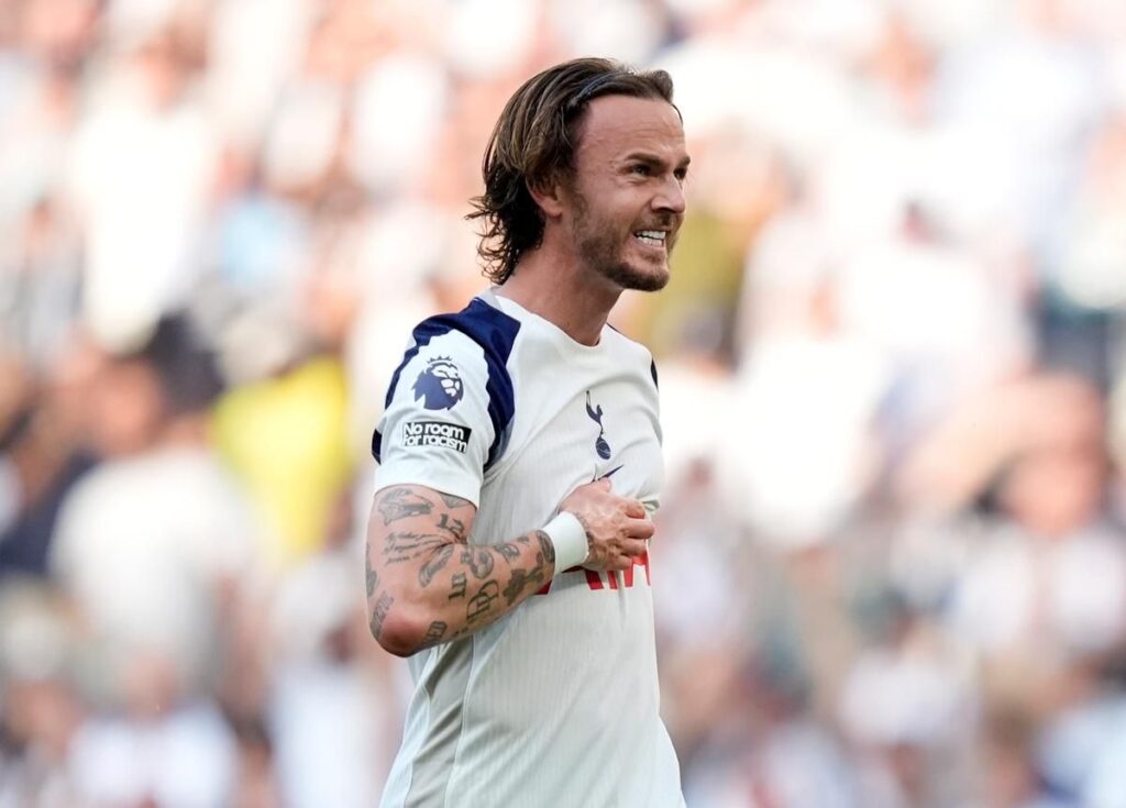 James Maddison looking serious in a Tottenham Hotspur kit during a Premier League match