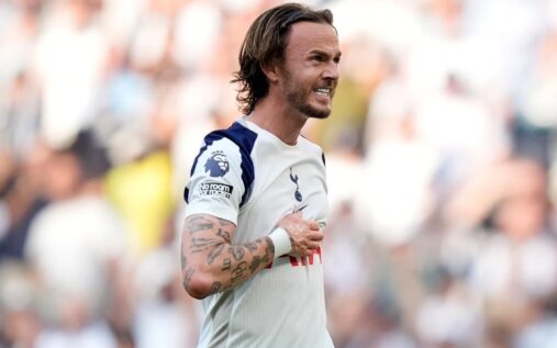 James Maddison looking serious in a Tottenham Hotspur kit during a Premier League match