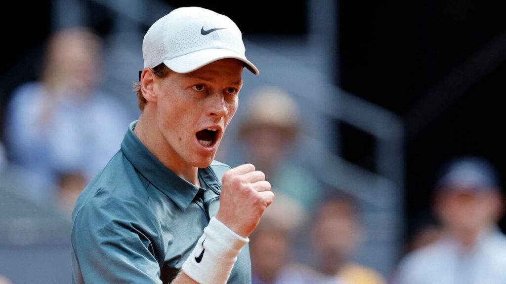 Jannik Sinner holds the Madrid Open trophy after defeating Alexander Zverev