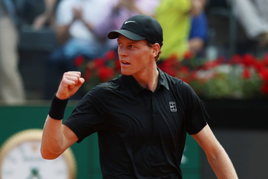 Jannik Sinner playing a forehand on the clay courts of the Italian Open