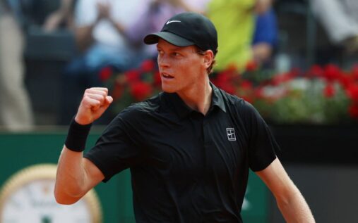 Jannik Sinner playing a forehand on the clay courts of the Italian Open
