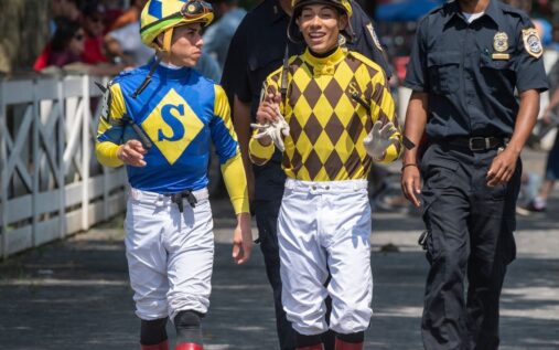 Jockeys Jose and Irad Ortiz riding racehorses on the dirt track