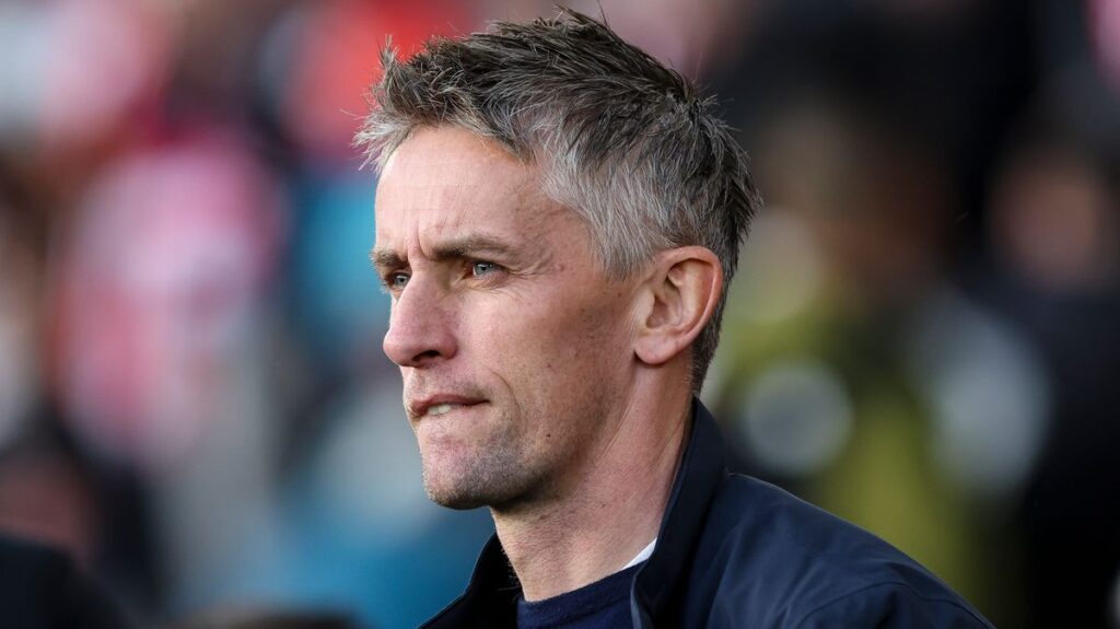 Ipswich Town manager Kieran McKenna applauding supporters on the touchline