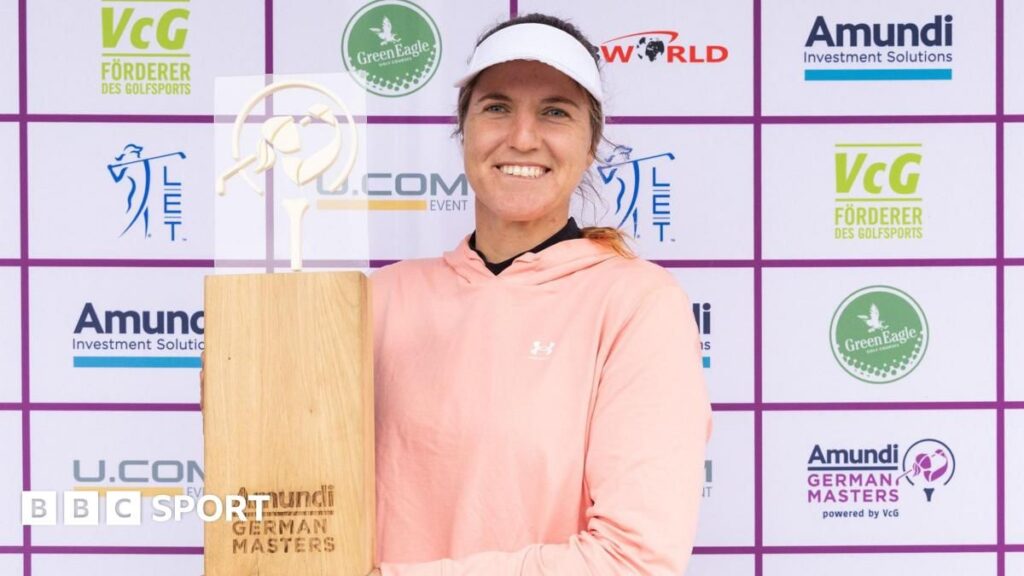 Leonie Harm holding the German Masters trophy after winning her maiden Ladies European Tour title.