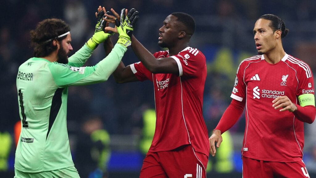Liverpool goalkeeper Alisson Becker pointing and shouting instructions to his teammates during a Premier League match