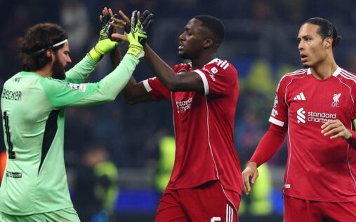 Liverpool goalkeeper Alisson Becker pointing and shouting instructions to his teammates during a Premier League match