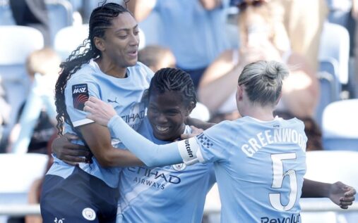 Manchester City players celebrating winning the Women's Super League title