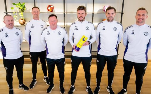 Michael Carrick standing on the touchline managing Manchester United
