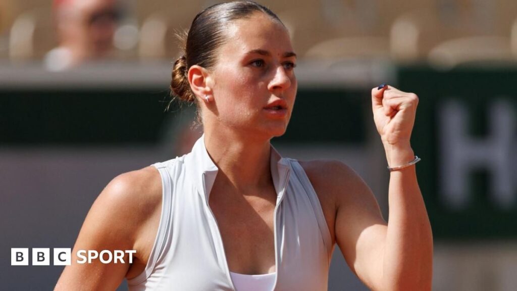 Marta Kostyuk wiping away tears during her emotional on-court interview at the French Open