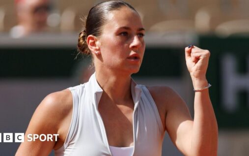 Marta Kostyuk wiping away tears during her emotional on-court interview at the French Open