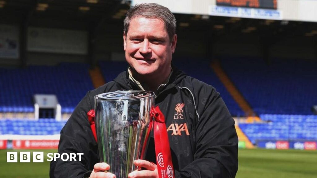 Former Burnley Women and Liverpool manager Matt Beard standing on the touchline during a football match