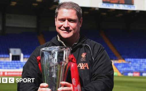 Former Burnley Women and Liverpool manager Matt Beard standing on the touchline during a football match