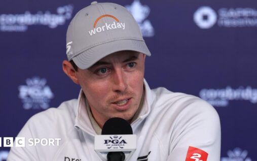 Matt Fitzpatrick lines up a putt on the green during a PGA Tour golf tournament