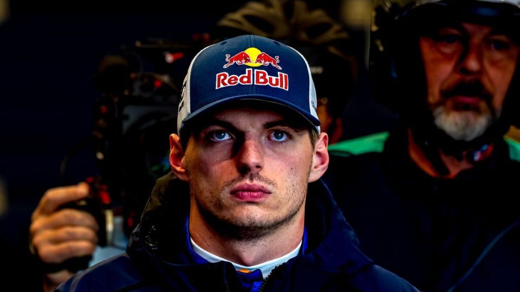 Max Verstappen wearing his racing suit in the pit lane at the Nurburgring 24 Hours